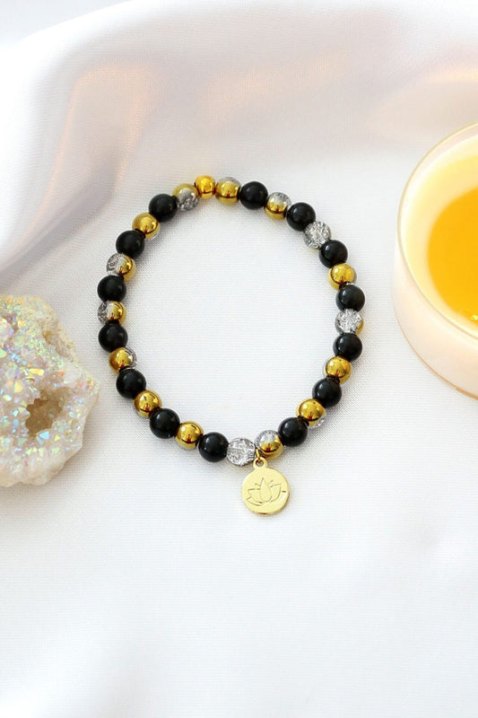 Elastiskt Armband i Obsidian med 24K Lotusblomma